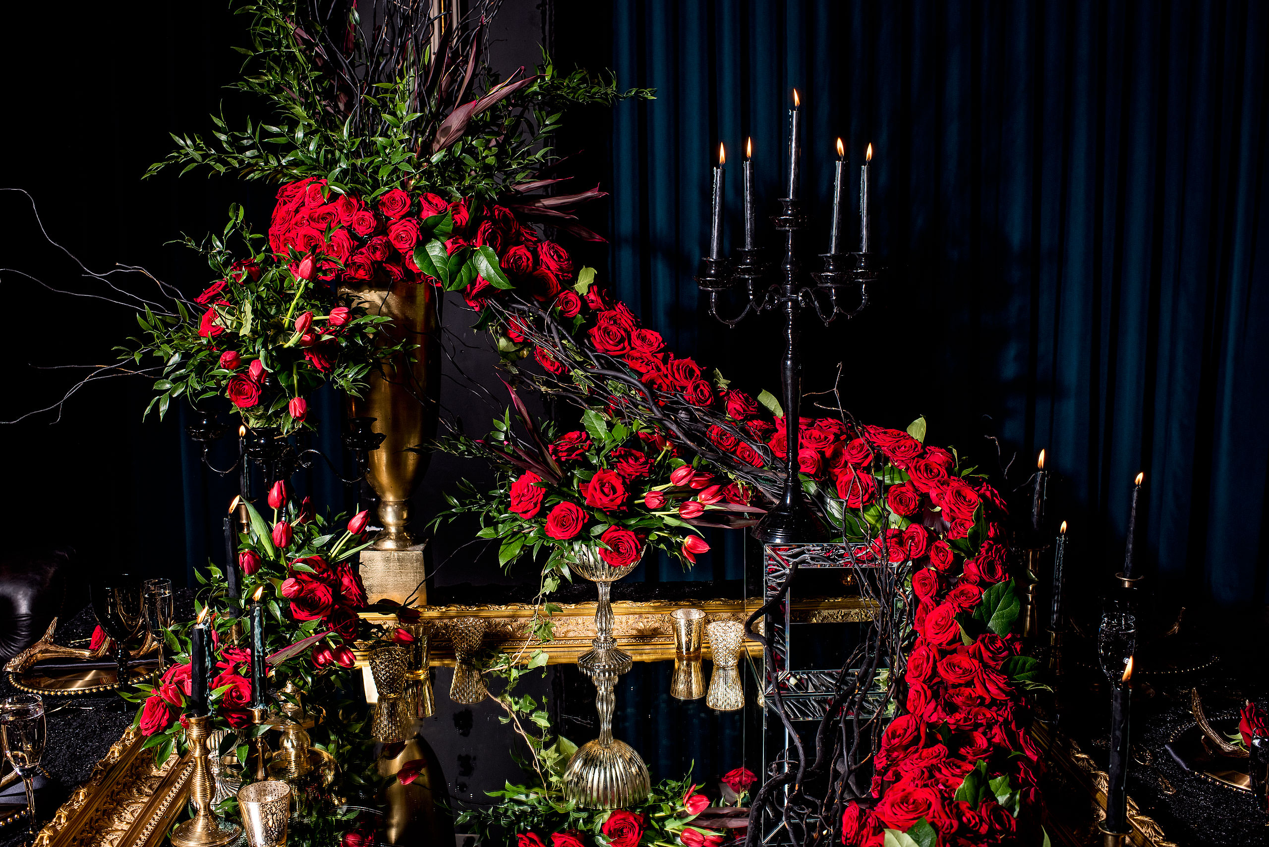 a long string of roses suspended above a mirror by calgary confetti fashion photographer sean leblanc