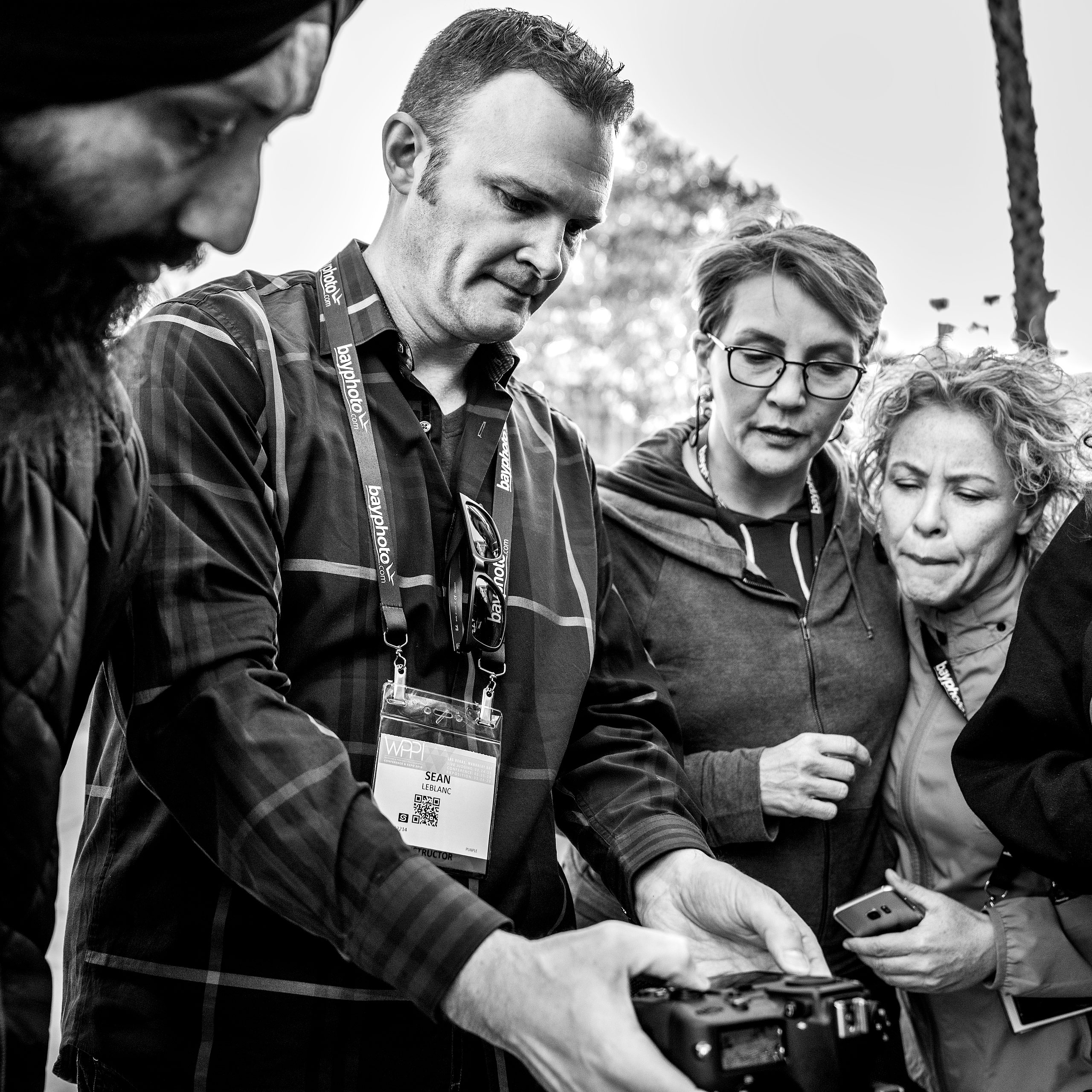 a group of photography students on a photowalk at WPPI learning about off camera flash - sean leblanc photography mentorship