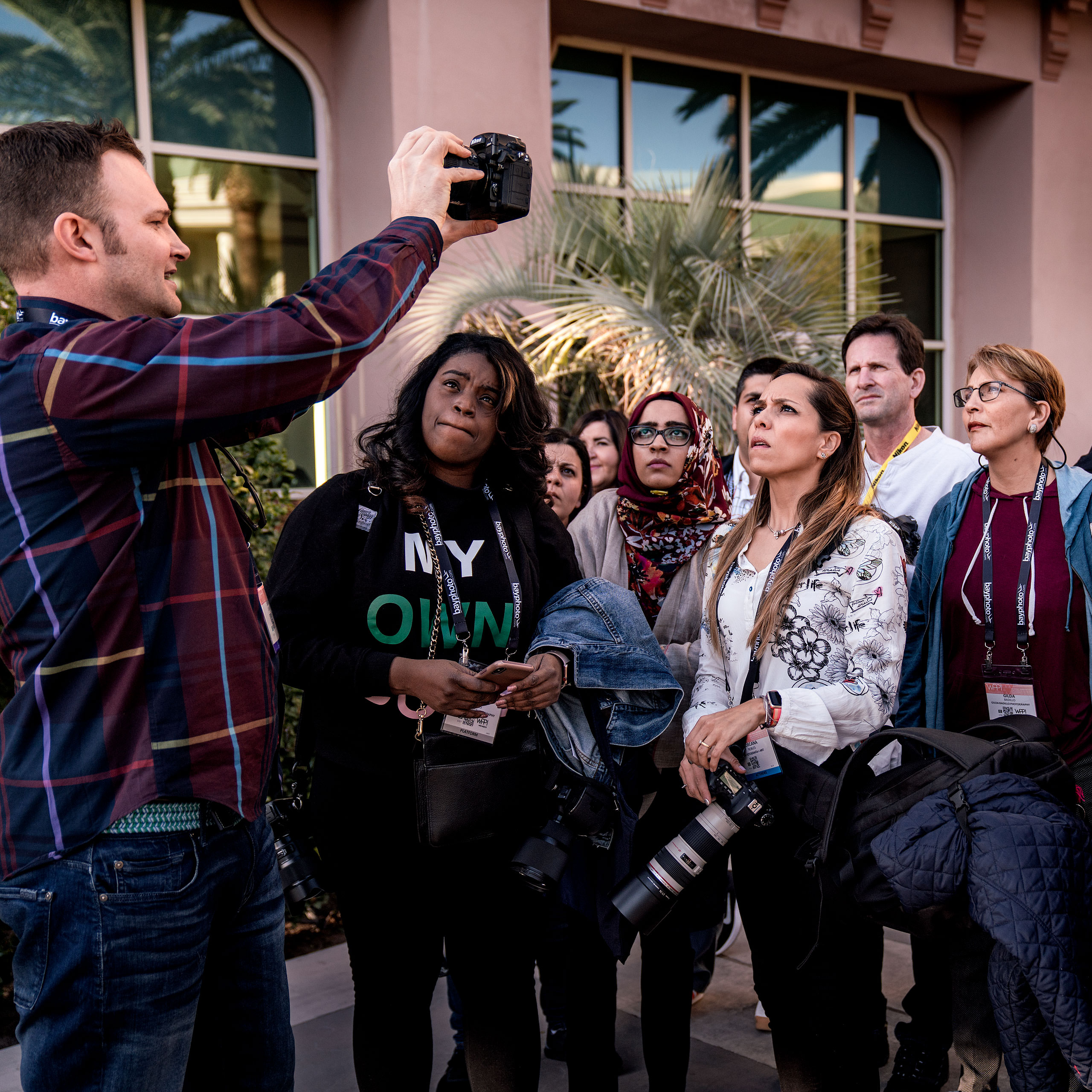 a group of photography students on a photowalk at WPPI learning about off camera flash - sean leblanc photography mentorship