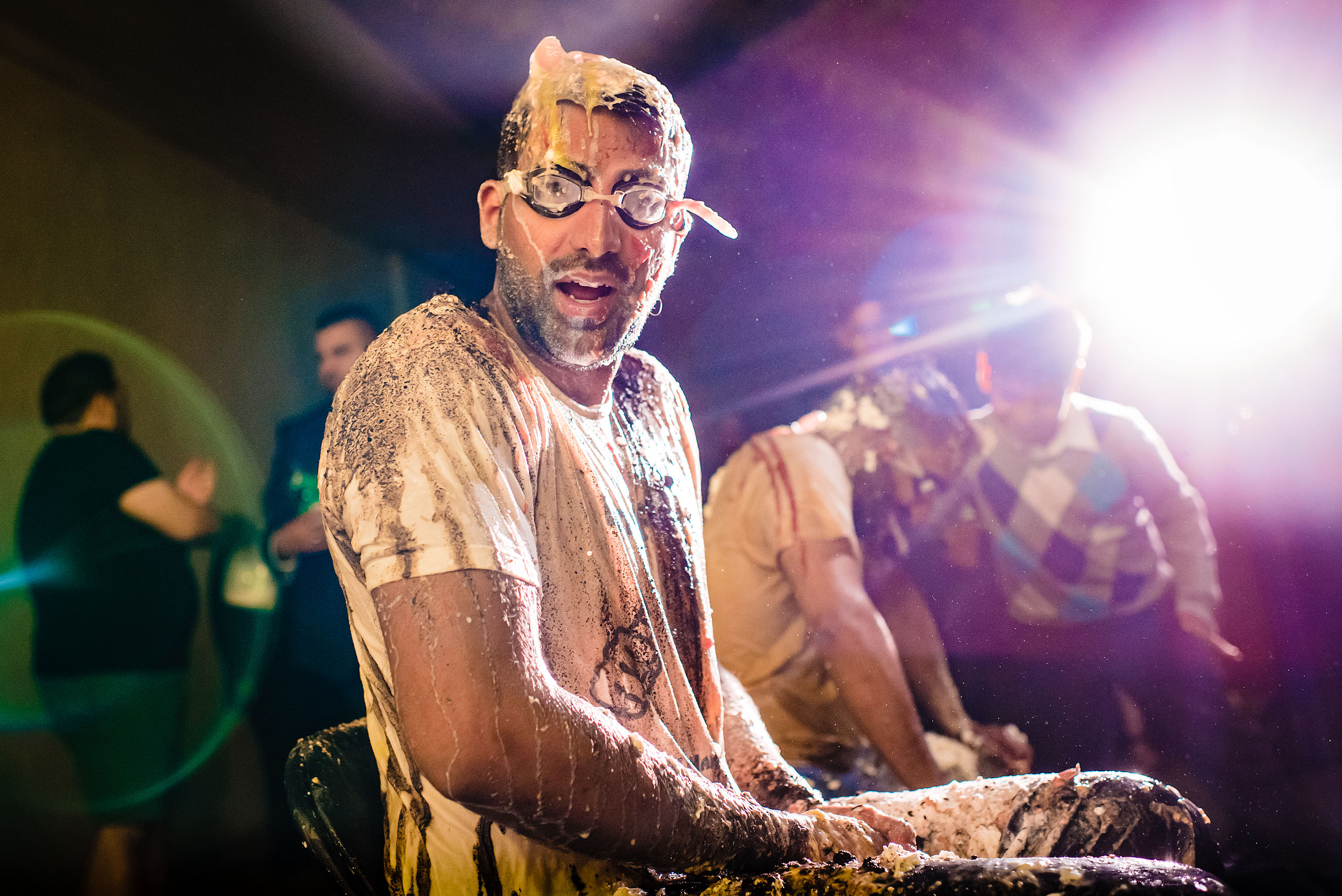 an Indian man wearing goggles by Calgary Banff Wedding Photographer Sean LeBlanc