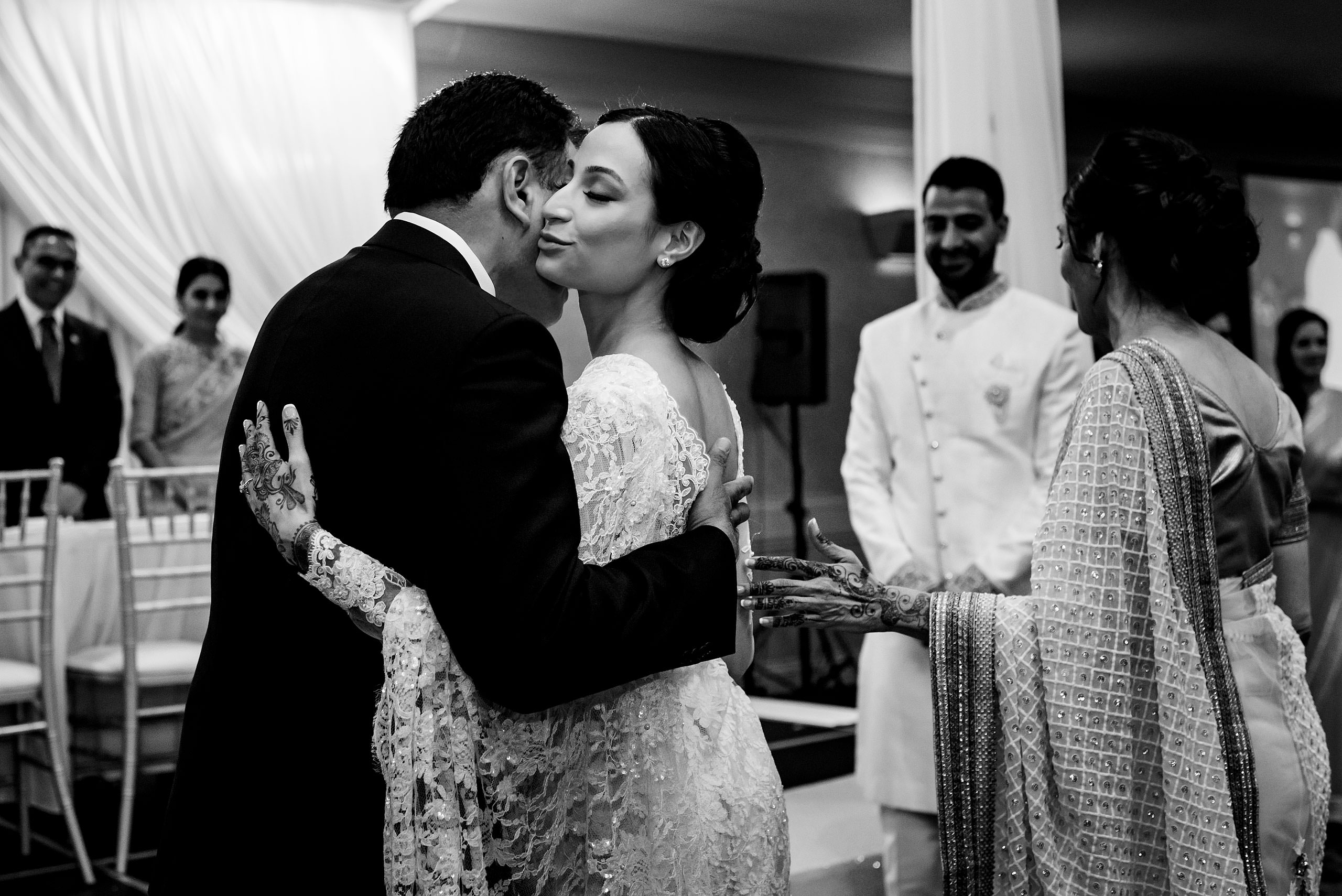 a daughter hugging her dad at a wedding ceremony by Calgary Banff Wedding Photographer Sean LeBlanc