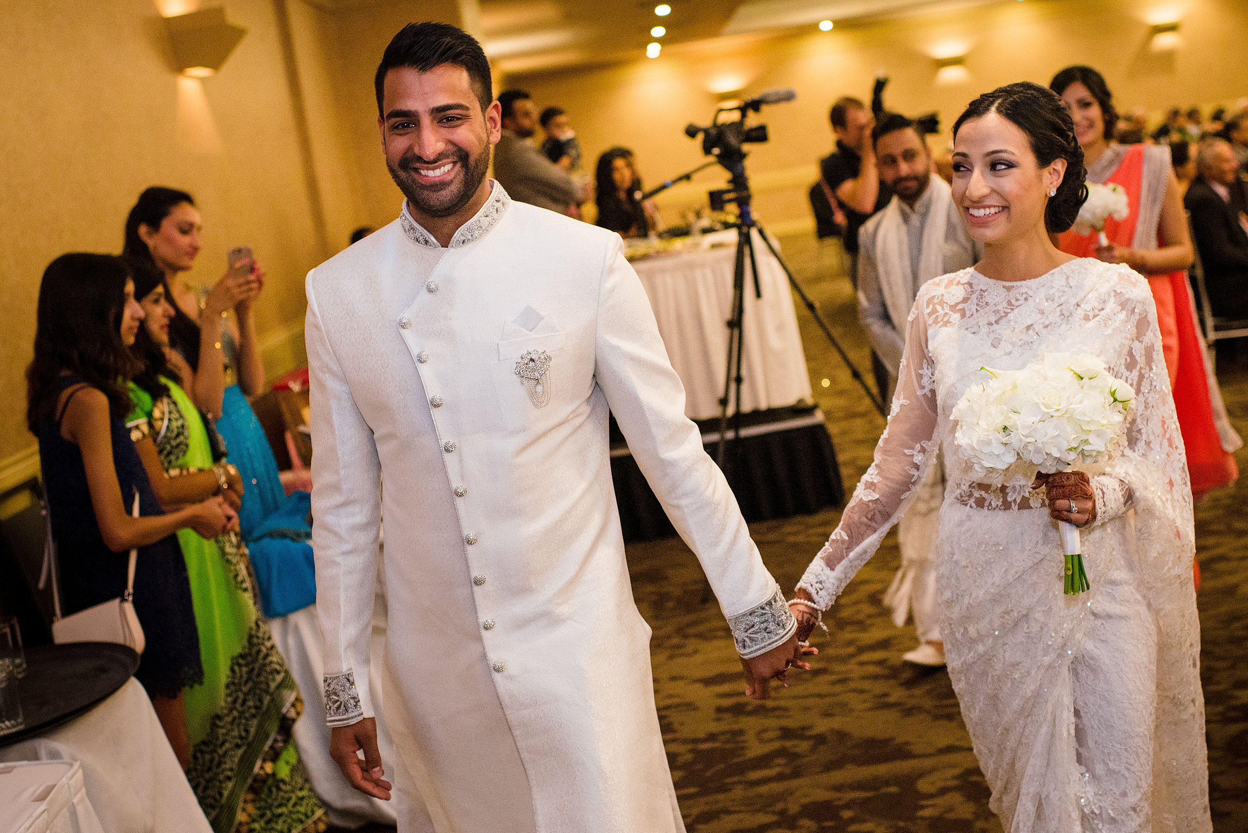 an Indian bride and groom walking away from their wedding ceremony by Calgary Banff Wedding Photographer Sean LeBlanc