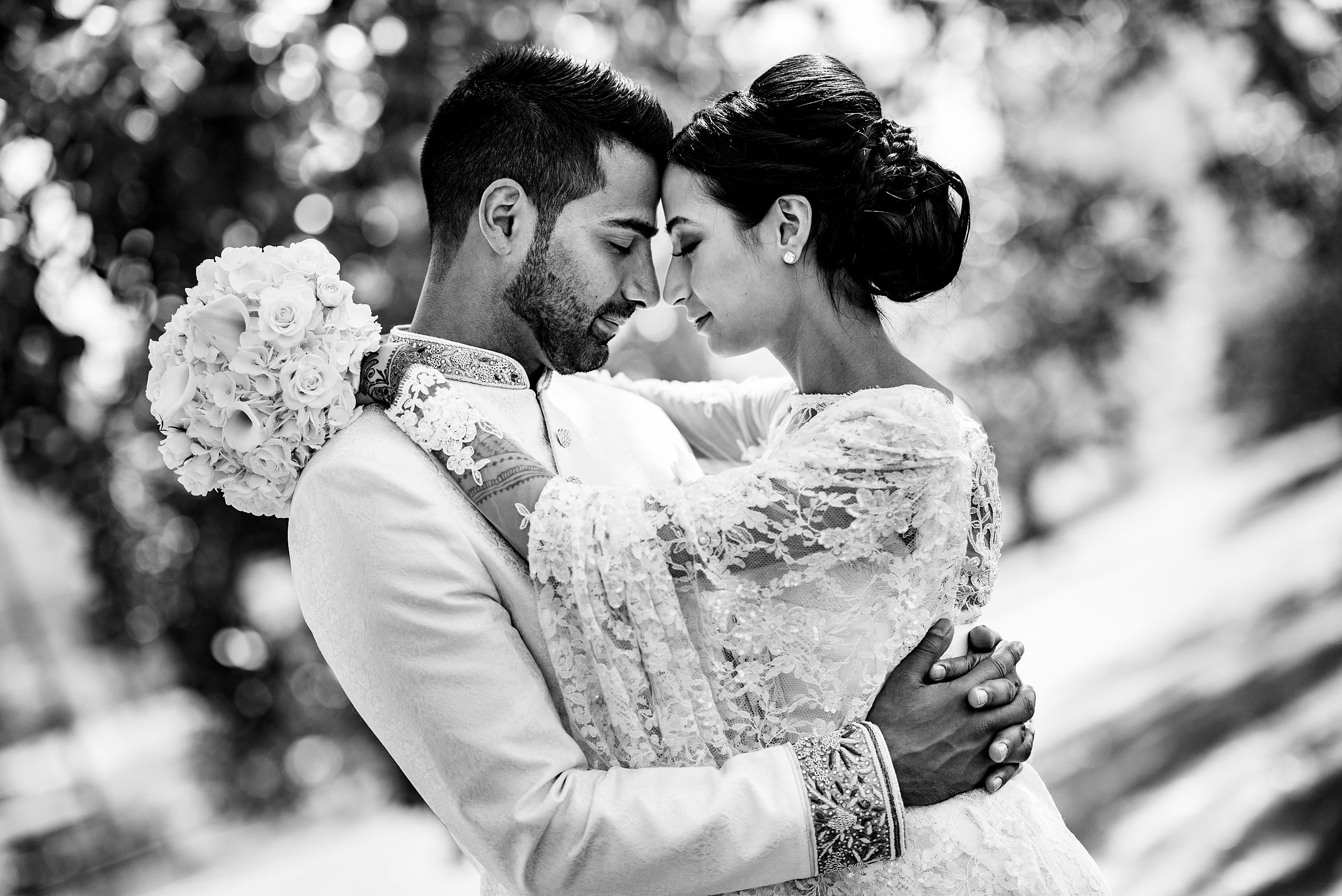 a bride and groom embracing by Calgary Banff Wedding Photographer Sean LeBlanc