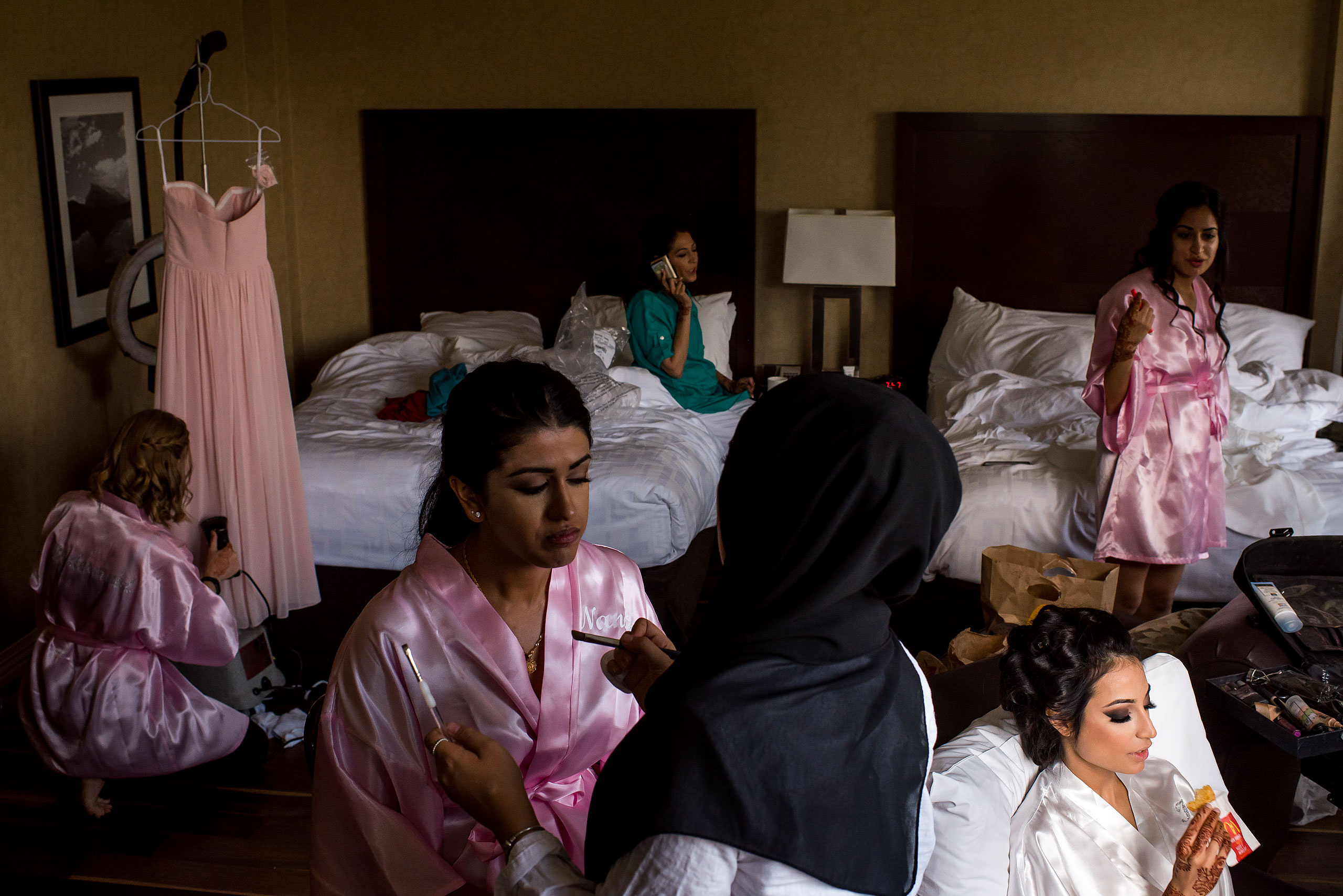 a group of bridesmaids getting ready by Calgary Banff Wedding Photographer Sean LeBlanc