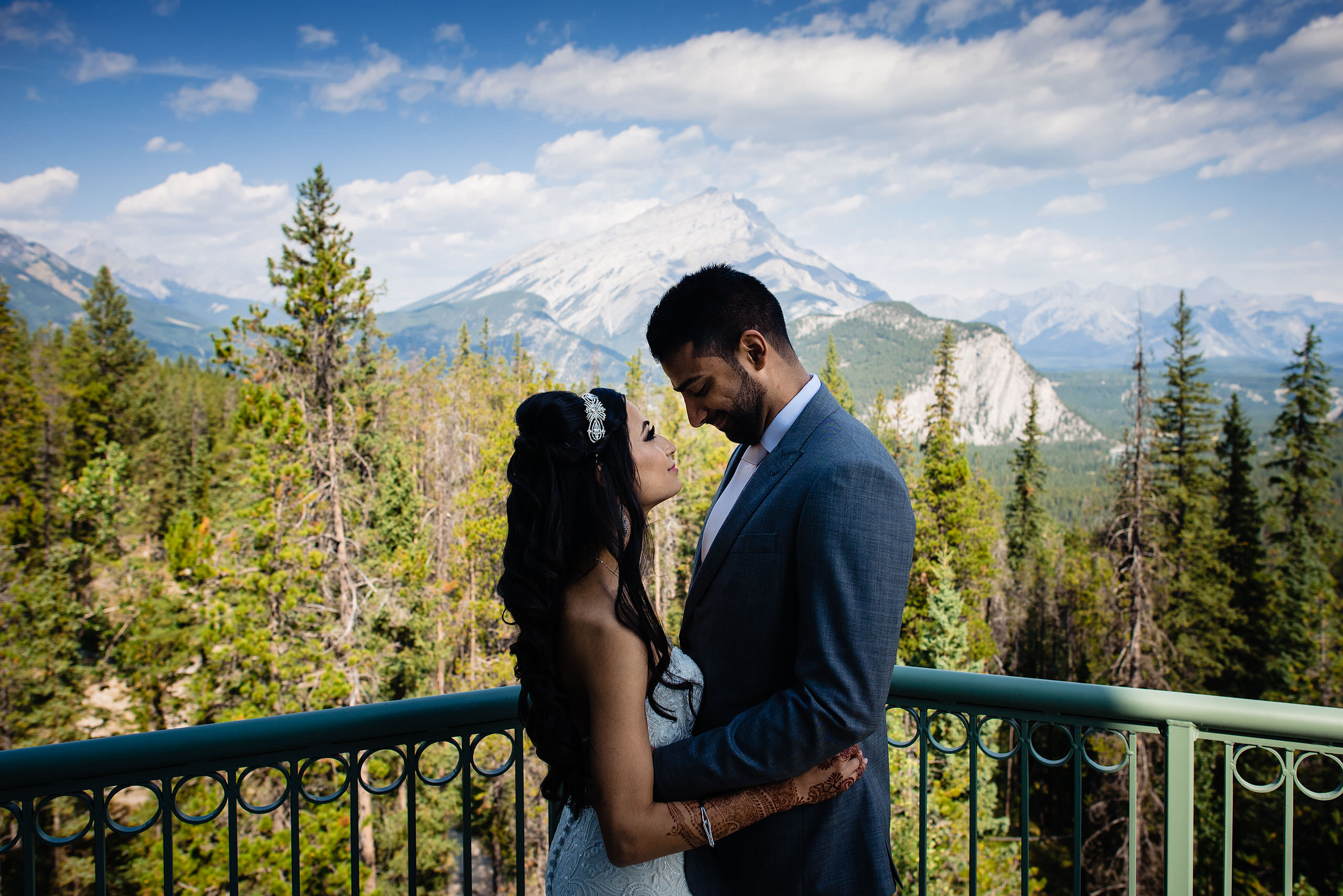 a bride and groom embracing at the Rimrock hotel by Calgary Banff Wedding Photographer Sean LeBlanc