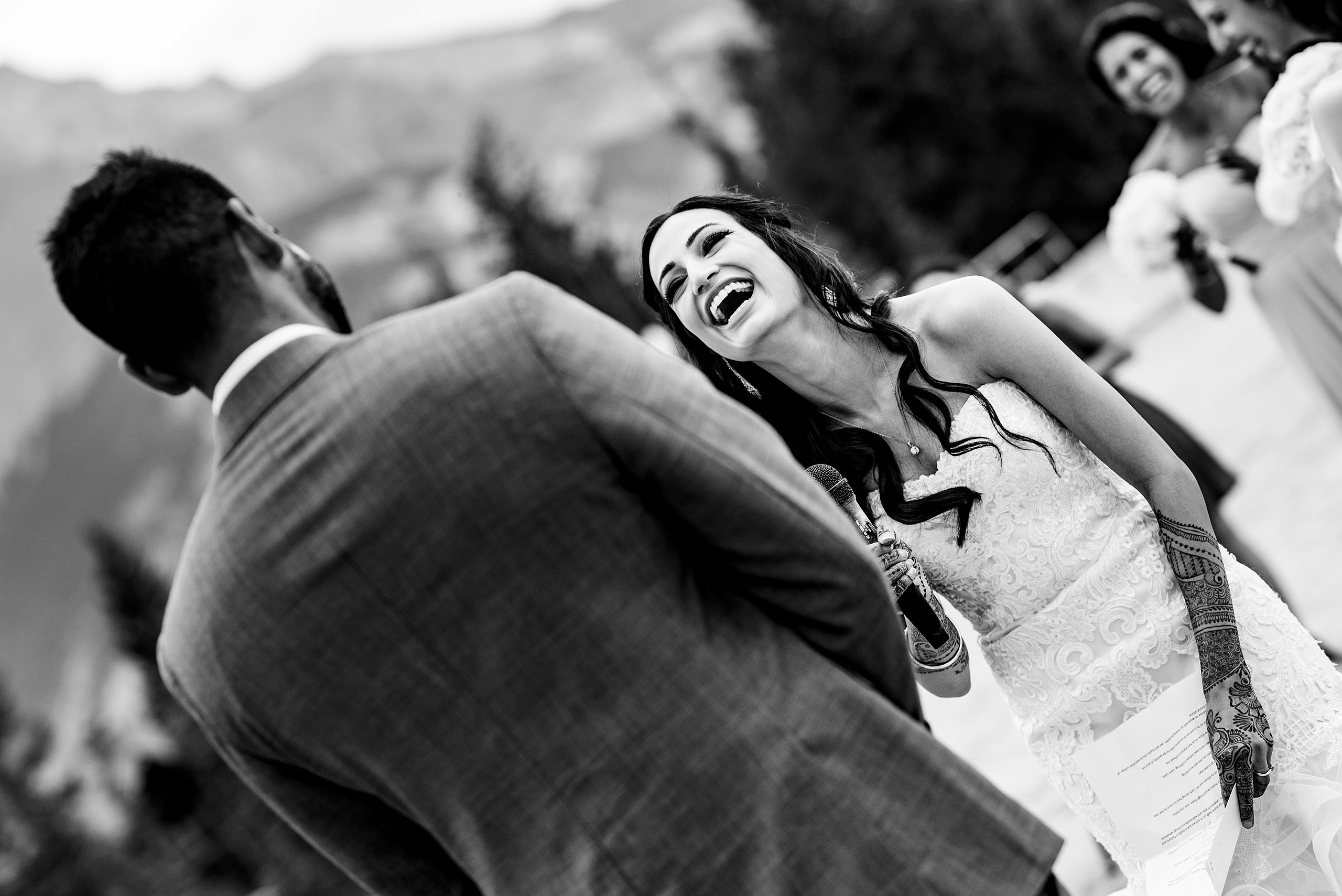 a bride laughing by Calgary Banff Wedding Photographer Sean LeBlanc