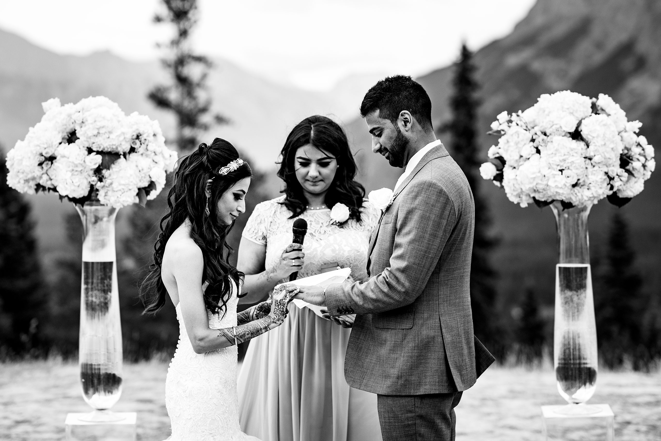 a bride and groom holding hands by Calgary Banff Wedding Photographer Sean LeBlanc