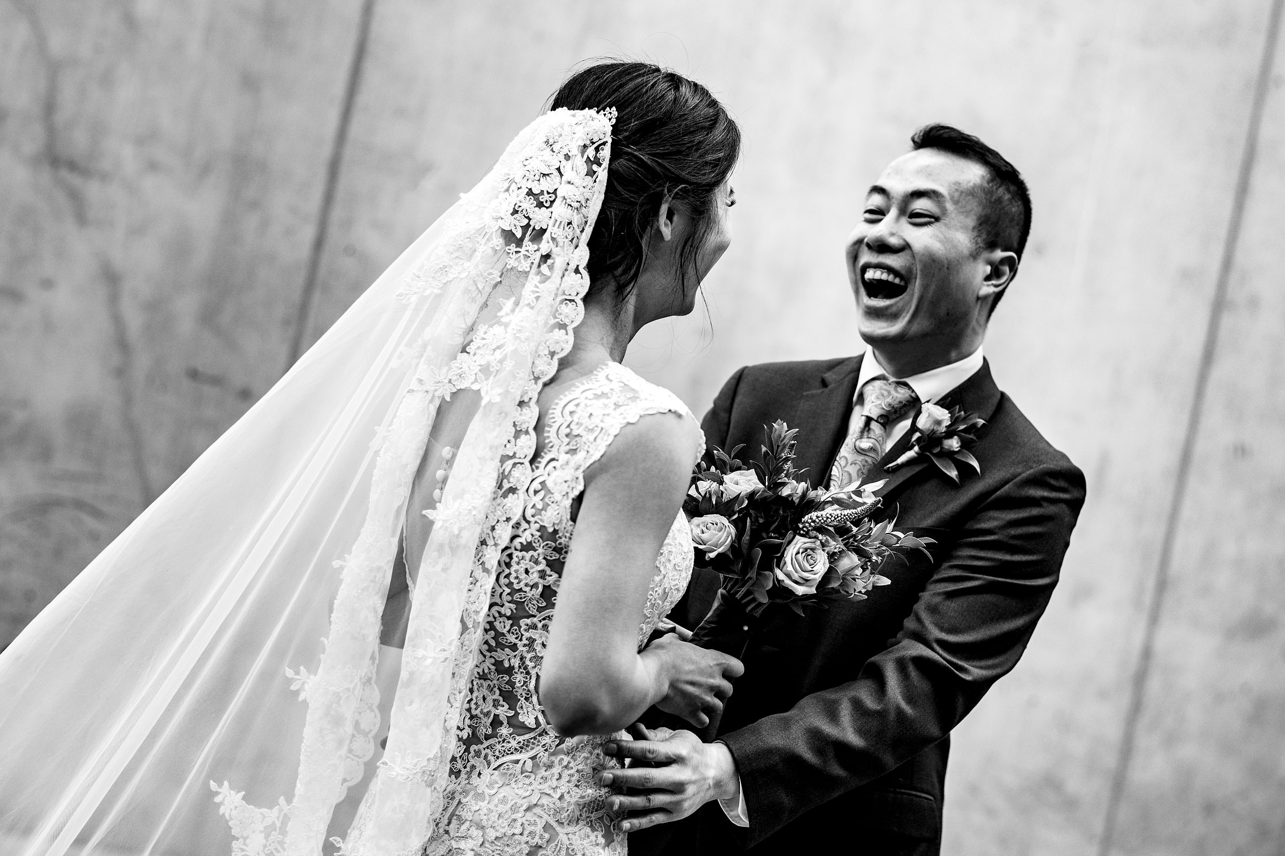 a groom and a bride at SAIT campus for their calgary lake house wedding by calgary wedding photographer sean leblanc photography