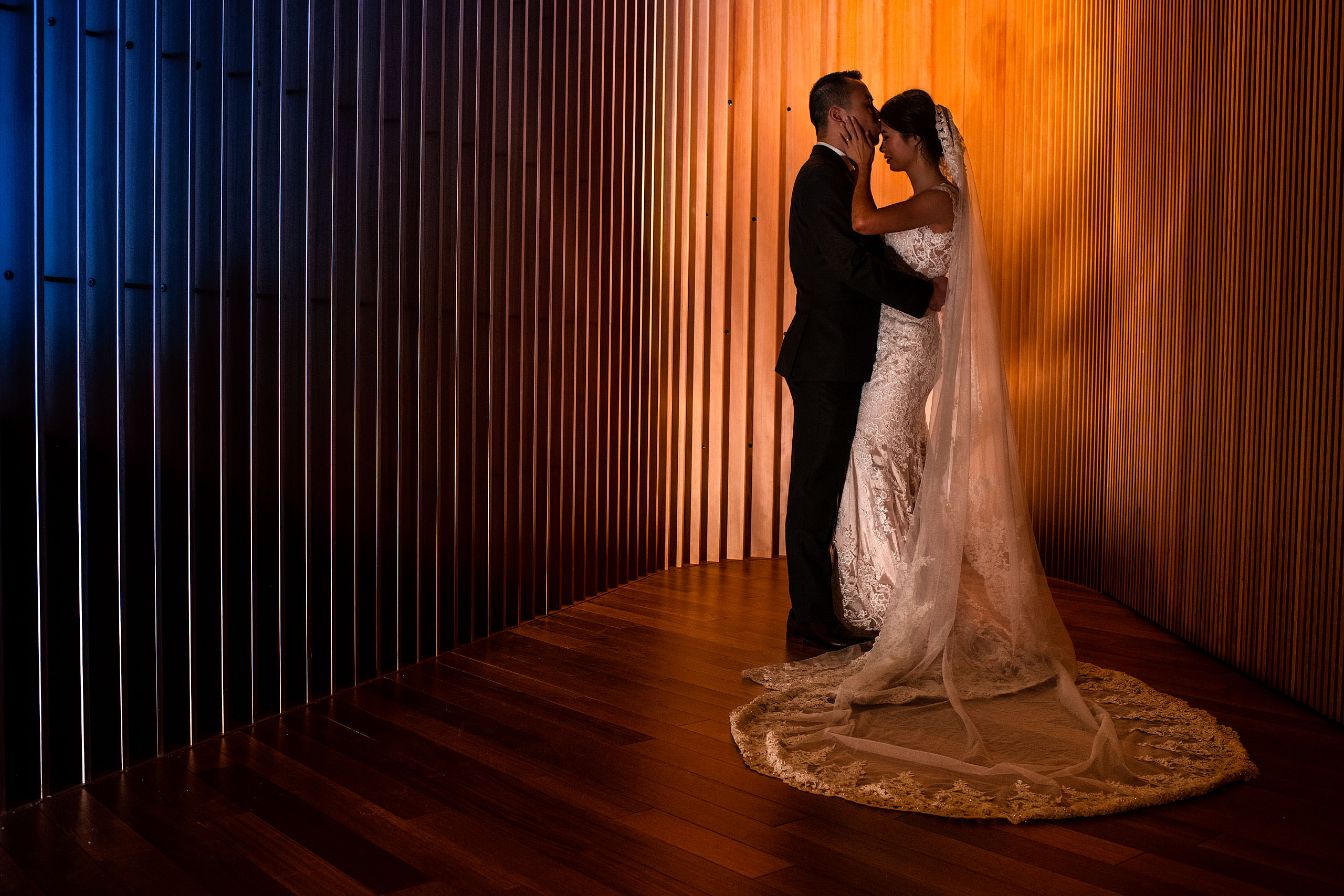 a creative bride and groom portrait at the calgary library for their calgary lake house wedding by calgary wedding photographer sean leblanc photography