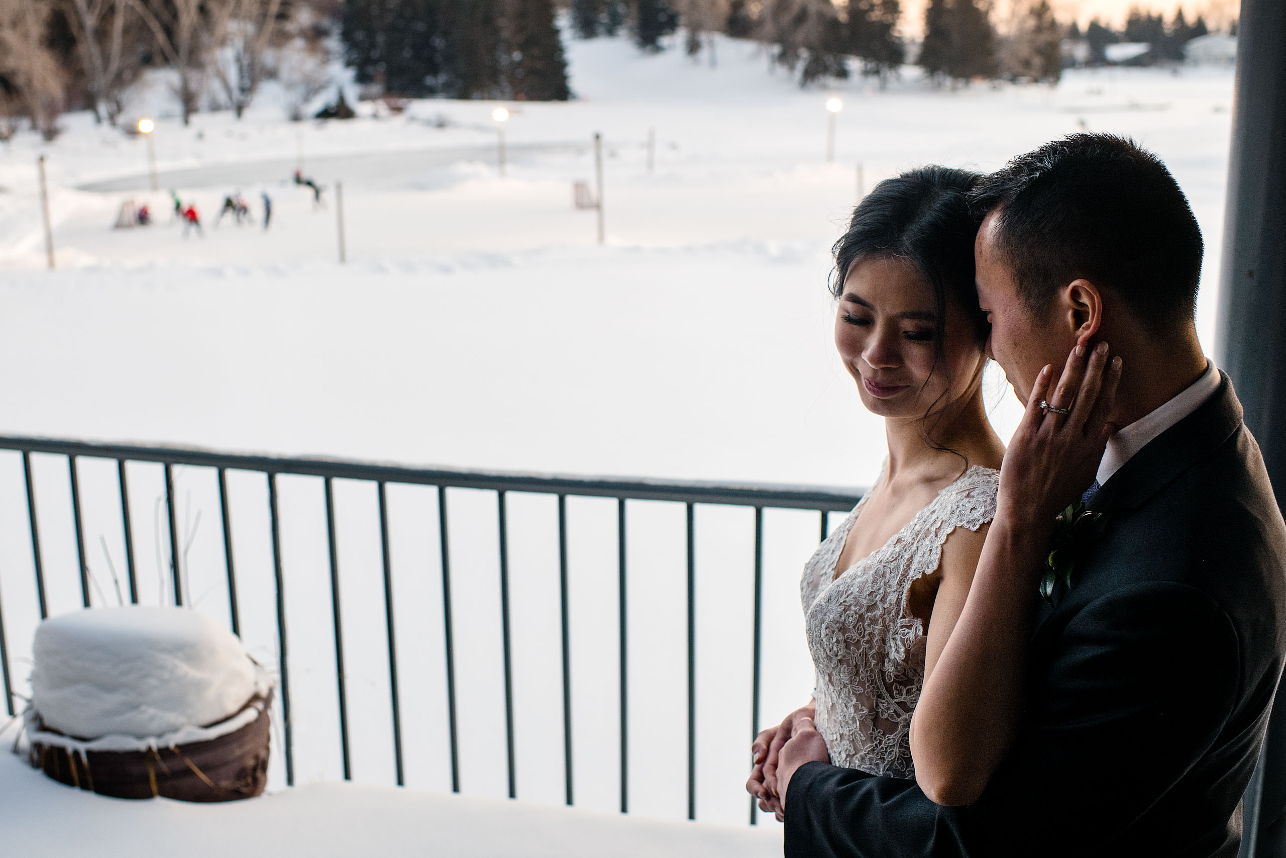 a bride and groom outside the lake house for their calgary lake house wedding by calgary wedding photographer sean leblanc photography