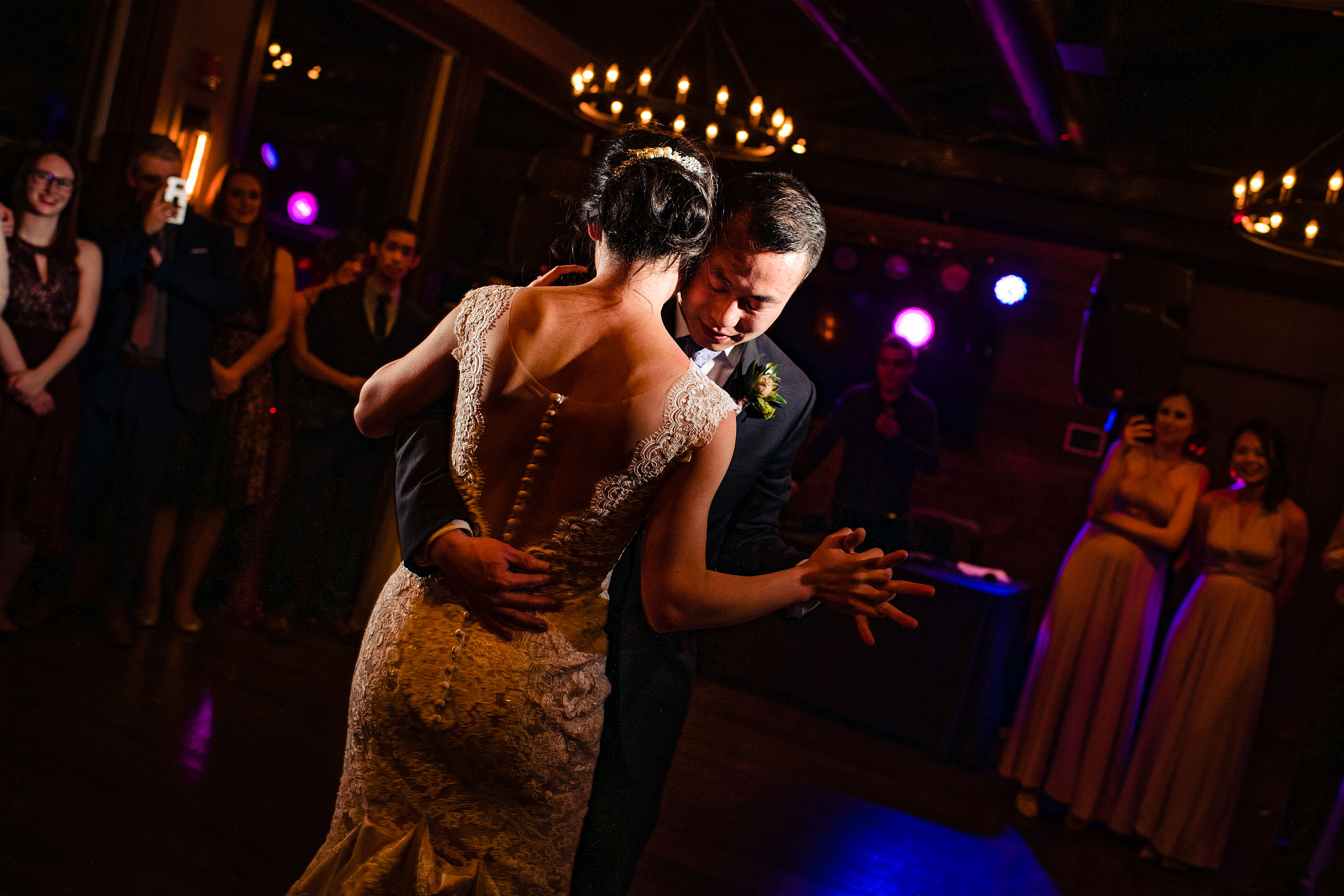 a bride and groom dancing during their calgary lake house wedding by calgary wedding photographer sean leblanc photography