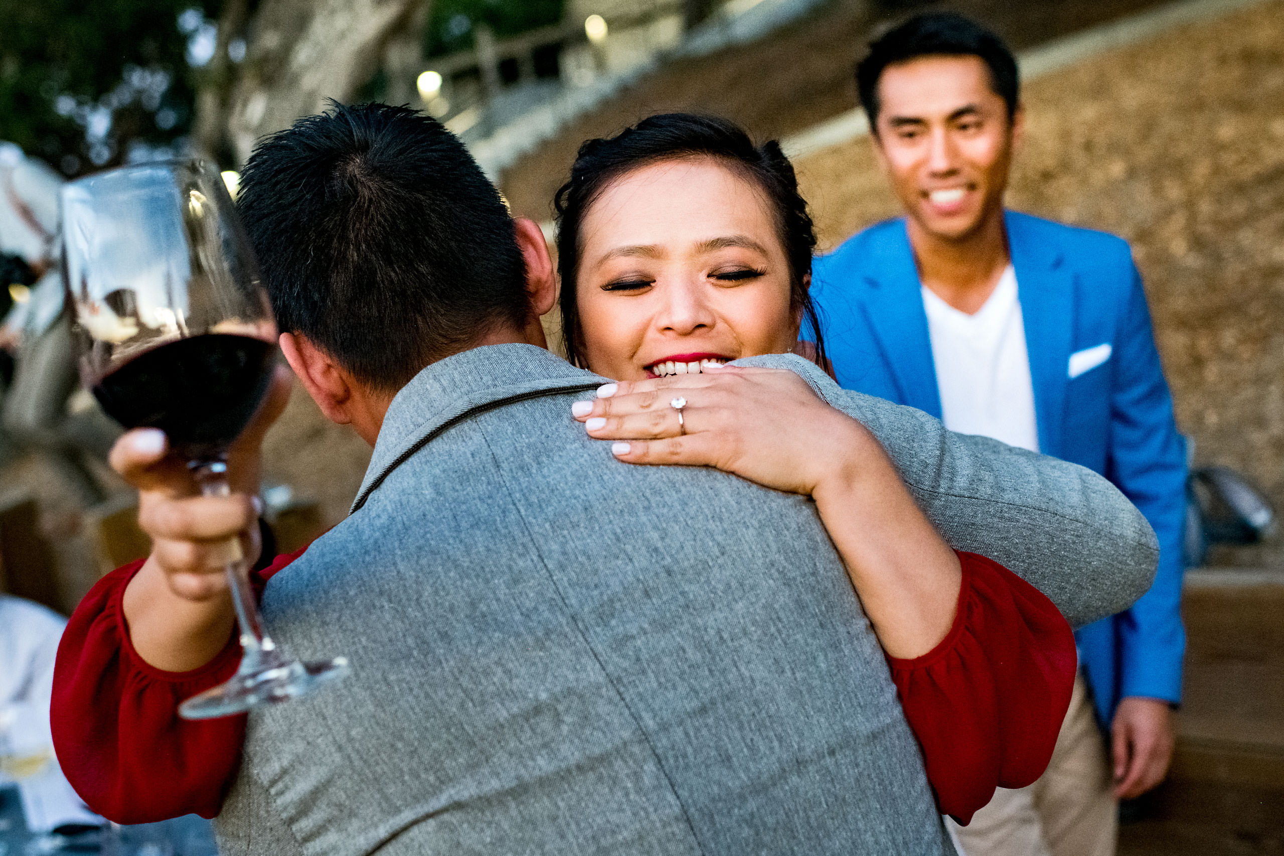 Bride embracing grooms brother by Carmel Valley Ranch Wedding Photographer Sean LeBlanc