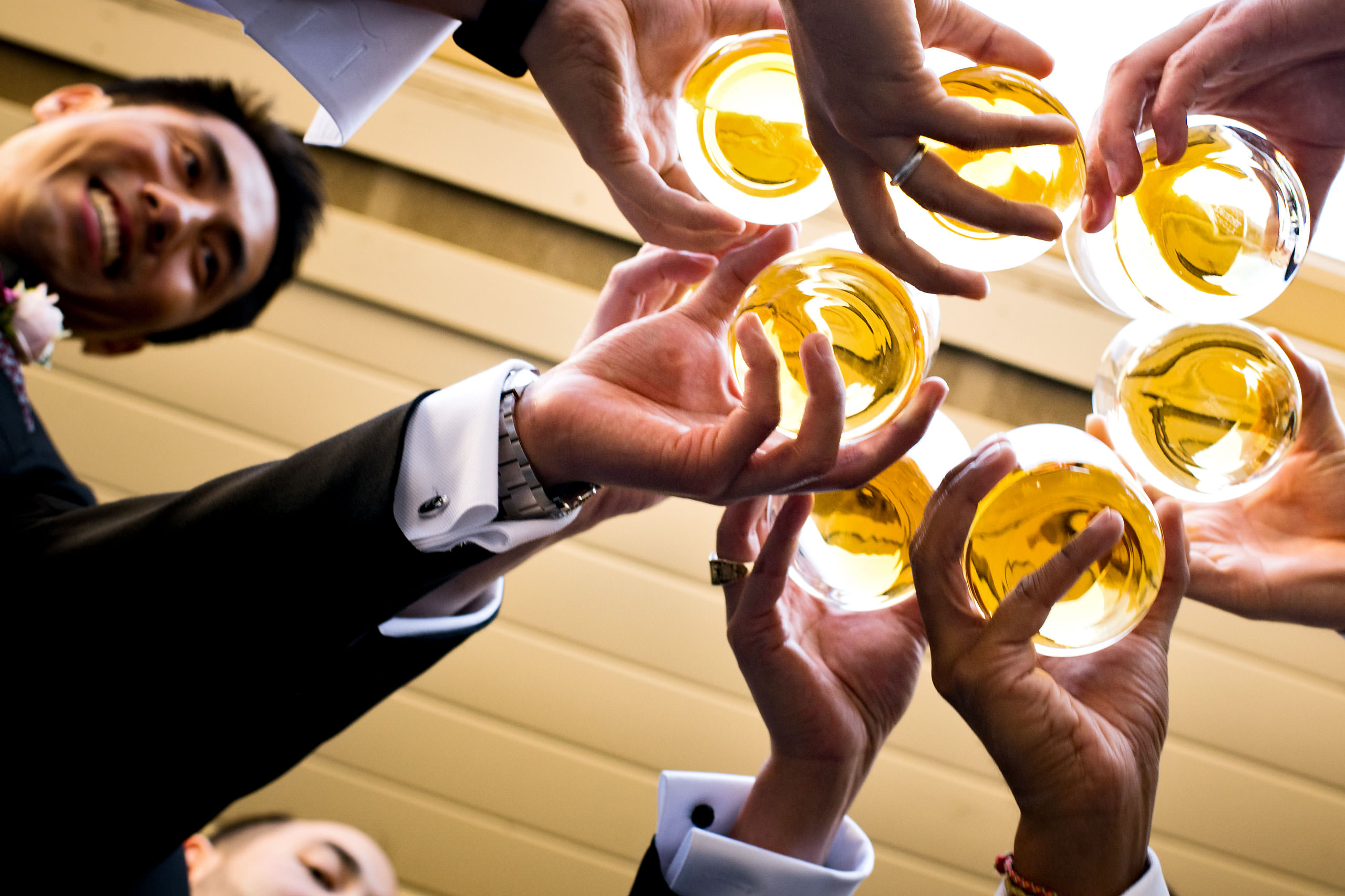 Groomsmen drinking whiskey by Carmel Valley Ranch Wedding Photographer Sean LeBlanc