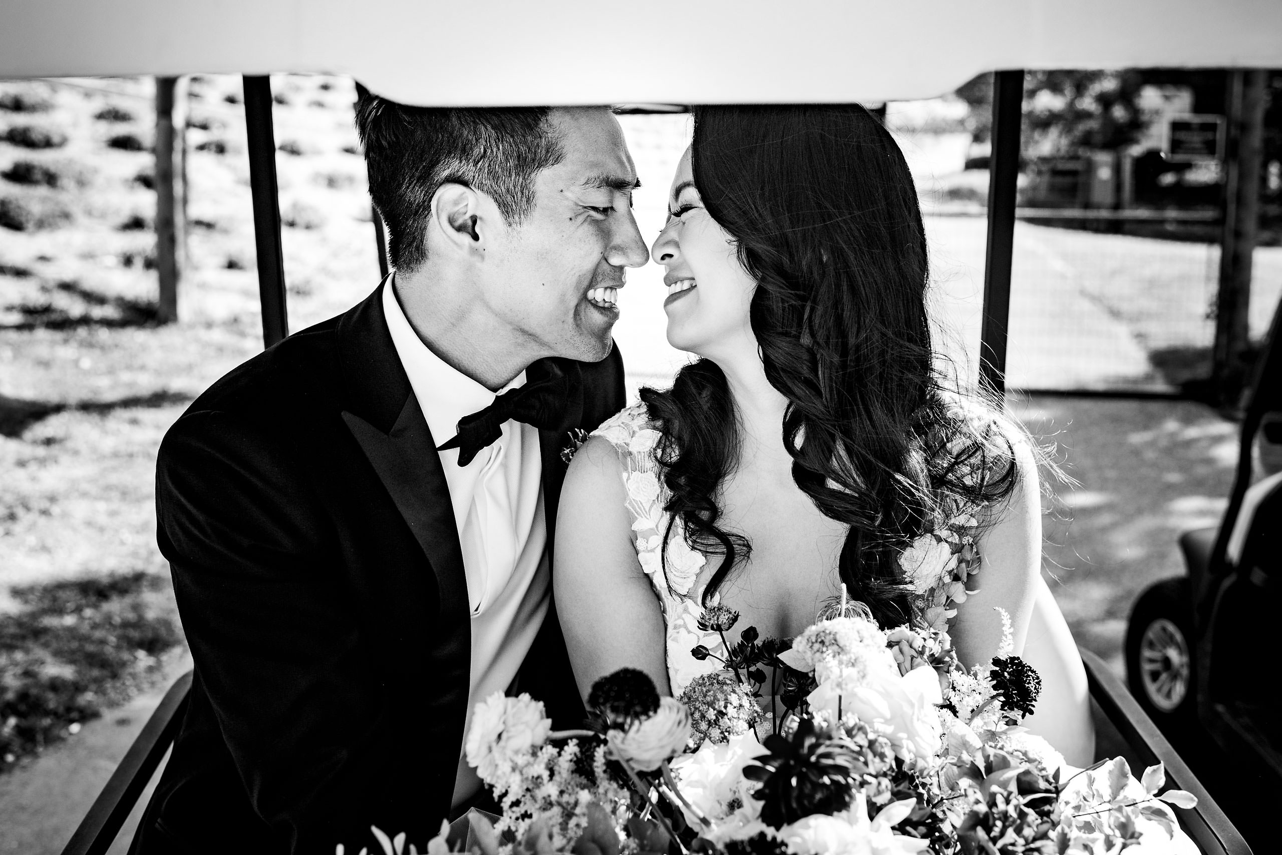 Bride and groom on a golf cart by Carmel Valley Ranch Wedding Photographer Sean LeBlanc