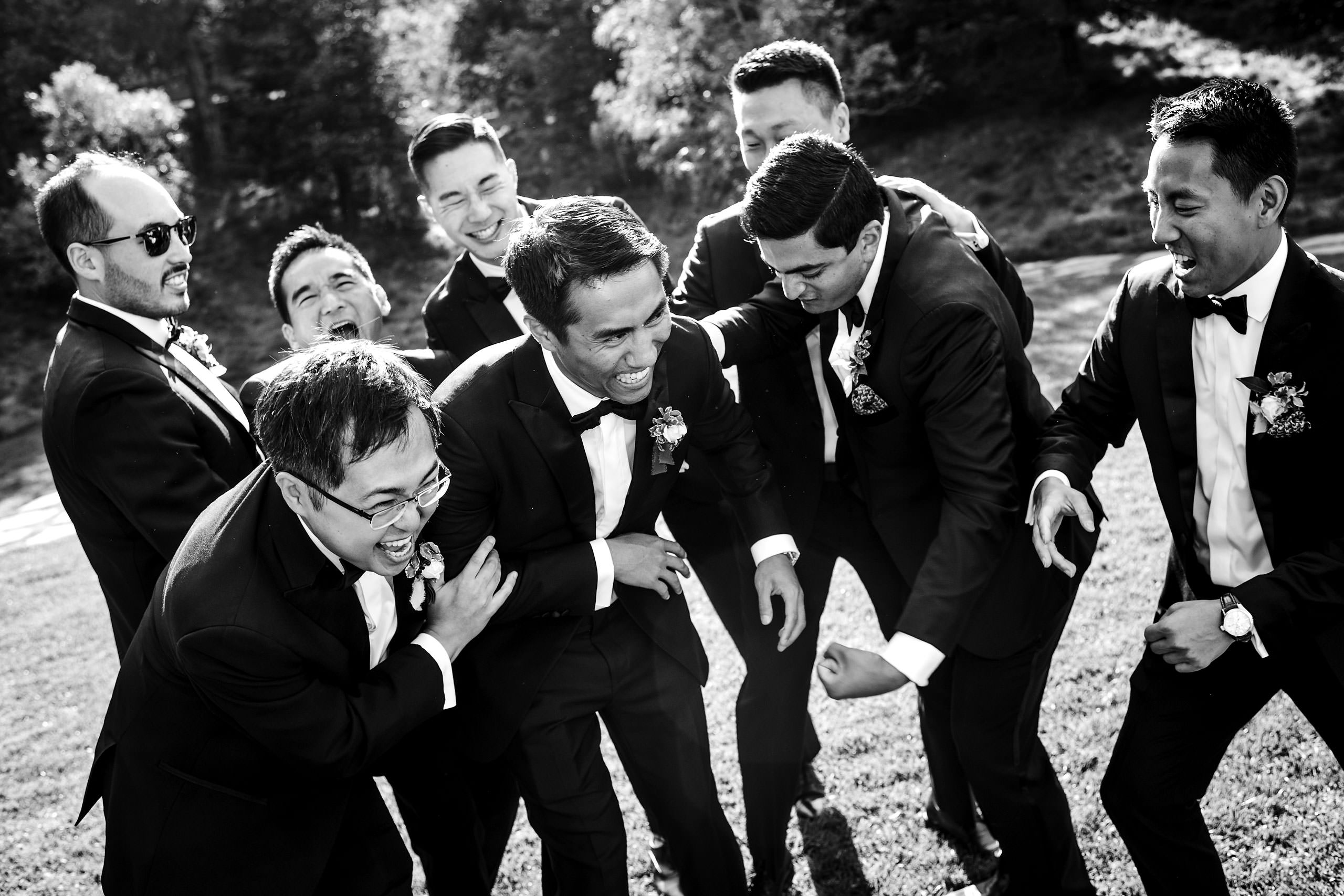 Groomsmen laughing by Carmel Valley Ranch Wedding Photographer Sean LeBlanc