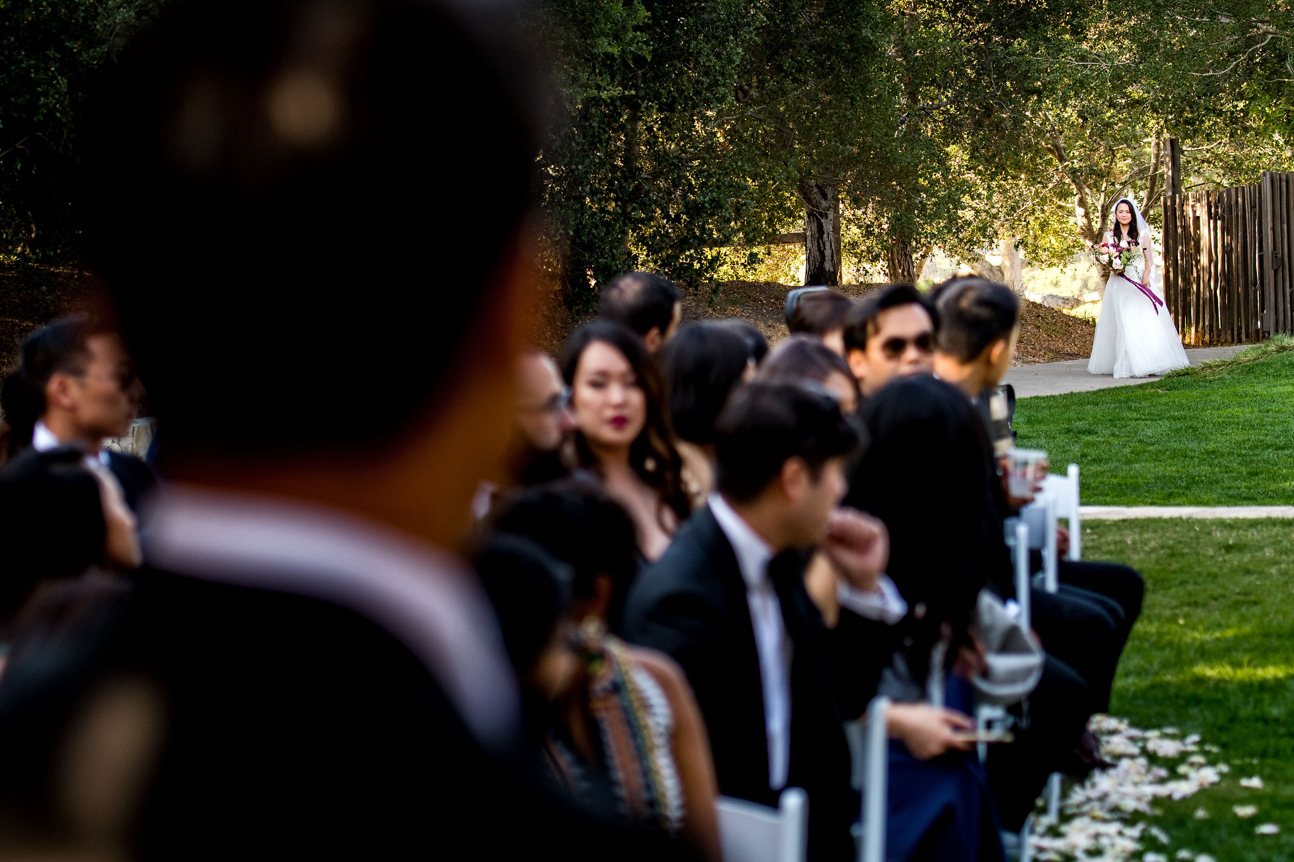 Bride walking down the aisle by Carmel Valley Ranch Wedding Photographer Sean LeBlanc